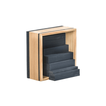 Wooden construction plank block set with light wood frame and dark charcoal slate pieces