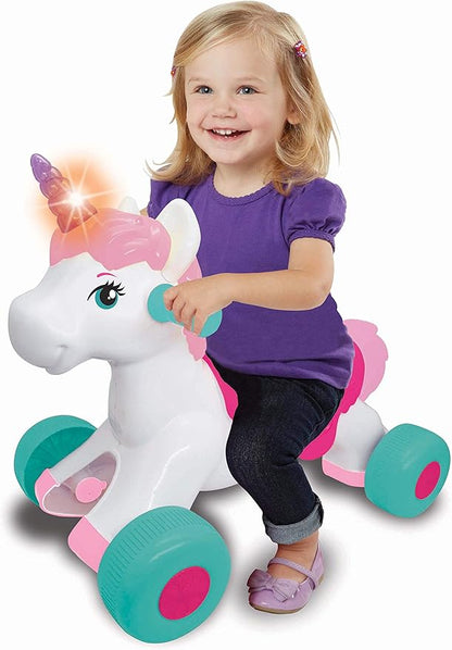 Ride-on unicorn toy with pink mane, teal wheels; child seated on saddle