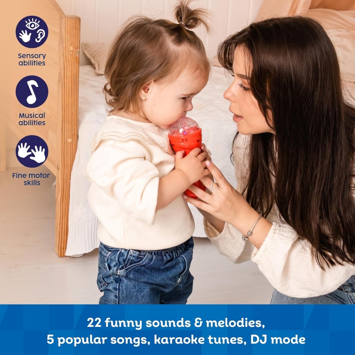 Red microphone phone toy in a child’s hands, music buttons and screen visible