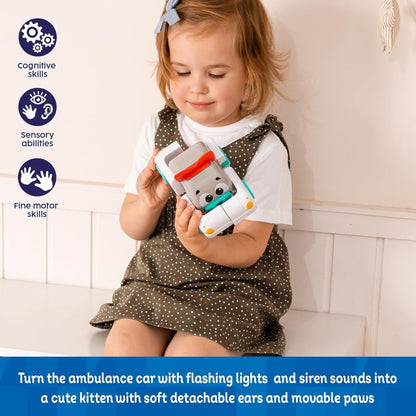 Toddler holding gray robot kitten toy with teal wheels and red light