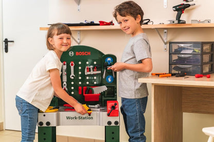 Bosch workbench station with green pegboard, tool accessories and side red compartments