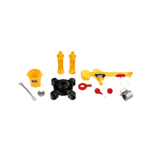 Construction crane playset parts: bucket, black base pieces, yellow rods and small tools