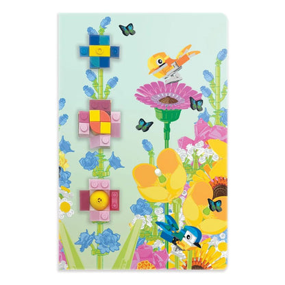 Notizbuchcover Botanicals mit bunten Pflanzen, gelber Blüte und Schmetterlingen