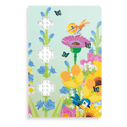 Notizbuchcover Botanicals mit gelbem Vogel, Schmetterlingen und blauen Blumen