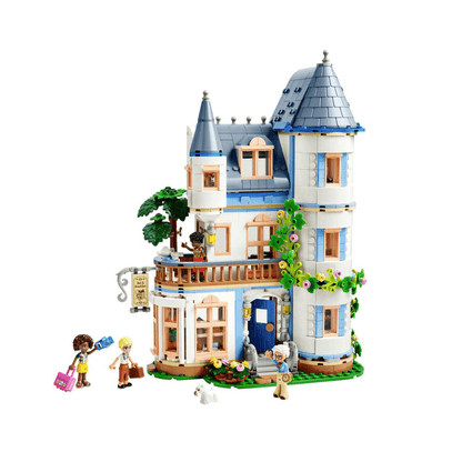 Blue-and-white LEGO castle with conical roofs, balconies, and garden flowers