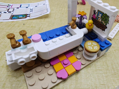 LEGO castle curved wall section with purple floor tiles and a round side door