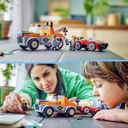 LEGO City tow truck with orange cab and black wheels, red sports car, and minifigures