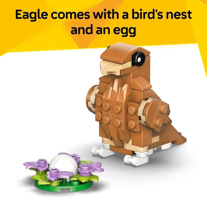 Brick-built eagle toy with purple nest pieces and white egg, brown and tan body
