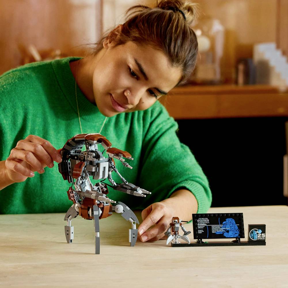 LEGO Droideka building set on table with poseable figure and instruction booklet