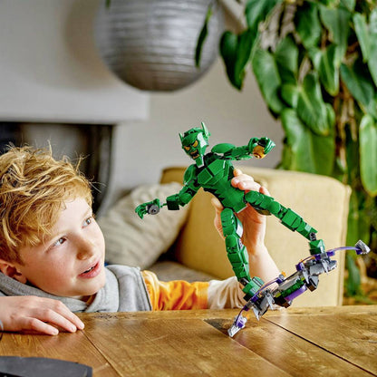LEGO Marvel construction figure in green armor held above purple-and-gray build