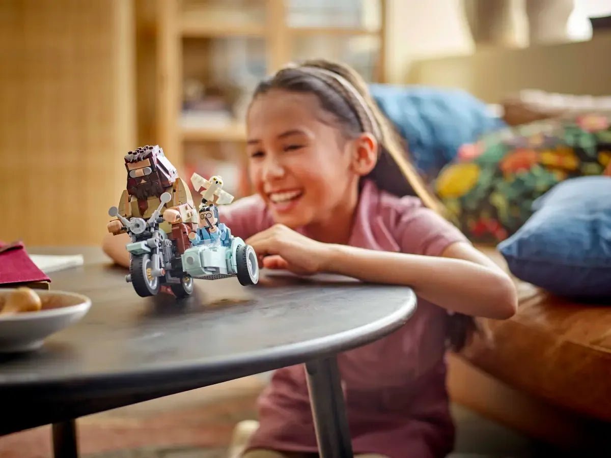 Child playing with LEGO Hagrid & Harry's Motorcycle Ride small motorcycle model