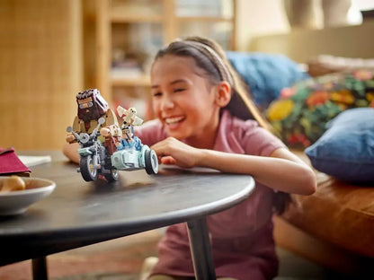 Child playing with LEGO Hagrid & Harry's Motorcycle Ride small motorcycle model