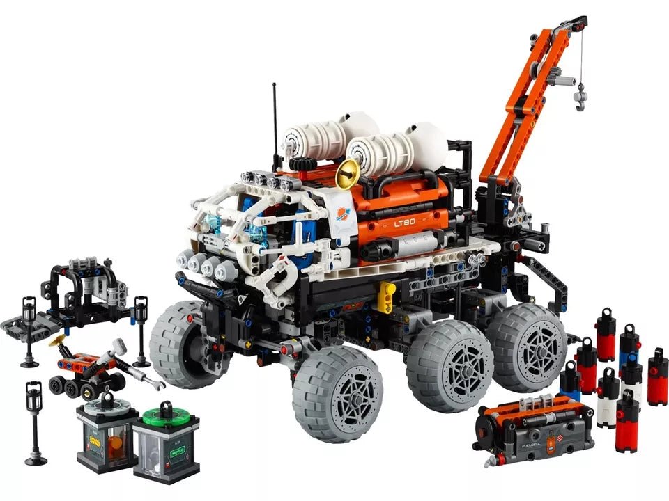 Mars Crew Exploration Rover model, orange crane arm, four large gray tires, spare modules