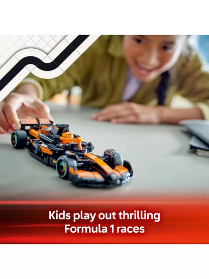 Orange-and-black race car model with driver minifigure, held on table