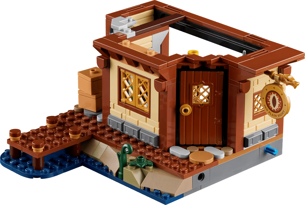 Red Dragon’s Tale small brown build with arched doorway, lattice windows, and platform