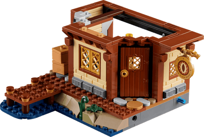 Red Dragon’s Tale small brown build with arched doorway, lattice windows, and platform