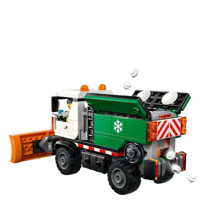 Snowplow truck from side view: orange plow, green rear, spinning auger-like parts and lights