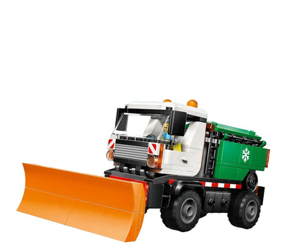 Snowplow truck LEGO build, orange front plow and green rear box with snowflake emblem