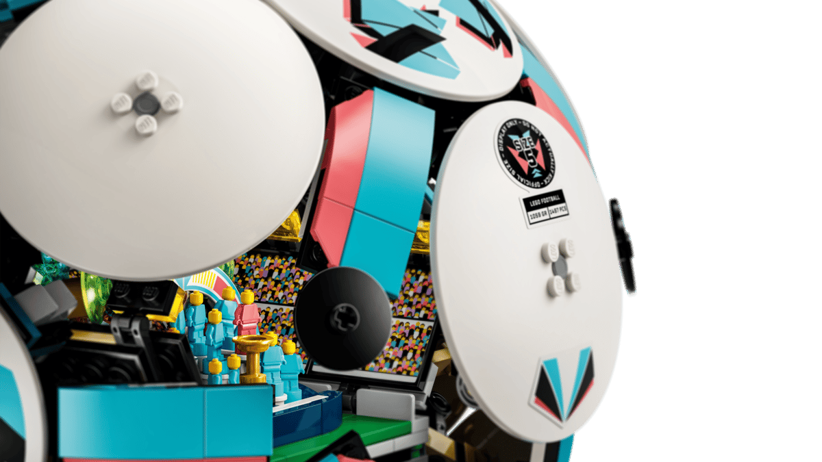 LEGO soccer ball toy side with white panel, logo sticker, and black hinge