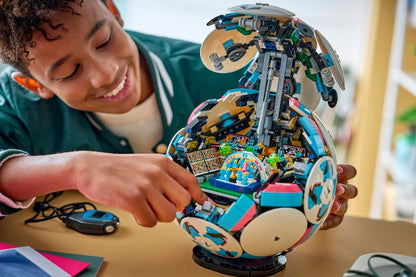 Child holding LEGO rotating soccer ball toy with white discs and exposed colorful interior