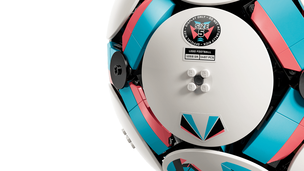 Close-up of LEGO soccer ball toy outer disc with size label and studs