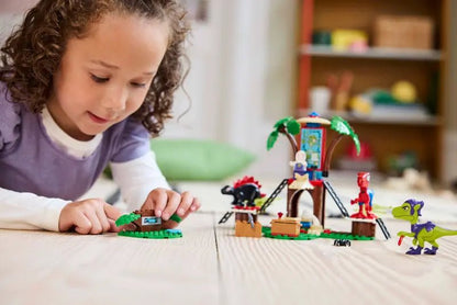 Spidey and Gobby raptor battle LEGO set with raptor characters and build pieces on a mat.