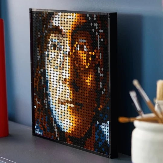 Framed LEGO brick mosaic picture of The Beatles with orange and blue dot details