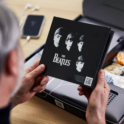 The Beatles Set packaging card with black-and-white band portrait design and QR code