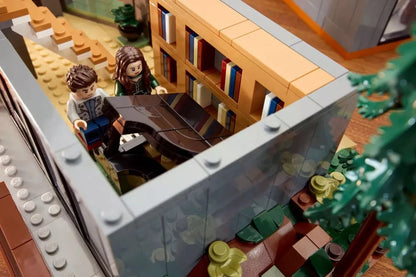 Mini figures in upper room of The Cullen House model, viewed through clear side wall