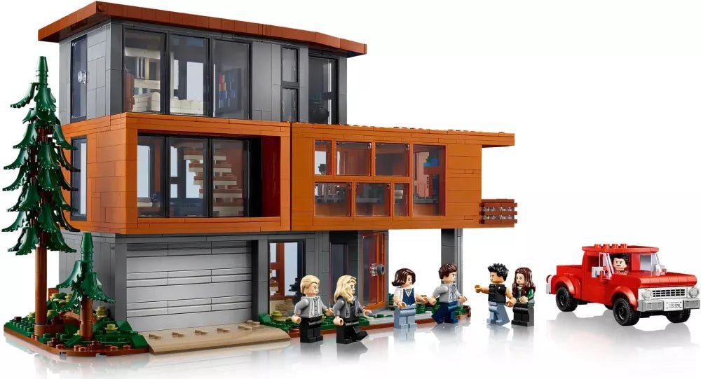Orange two-story LEGO house with large windows, minifigures in front, and red fire truck