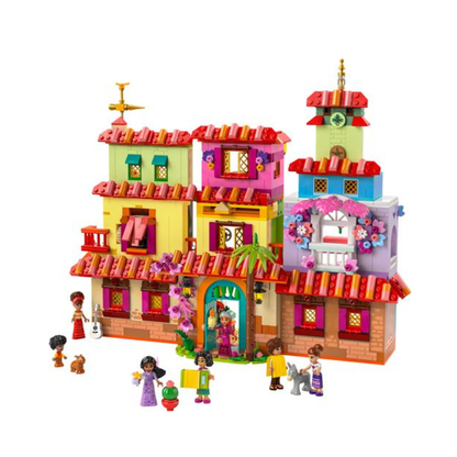Multicolored LEGO house model with red roof, flower arch, two towers, and minifigures