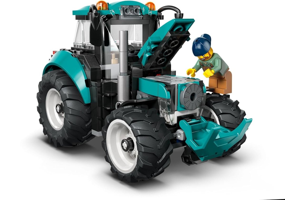 Teal and black LEGO tractor building set, front 3/4 view with driver figure