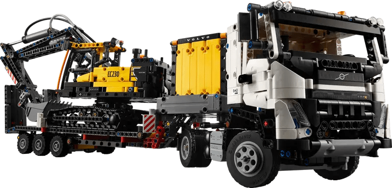 Volvo FMX Bagger-LKW Modell seitlich: gelbe Hydraulikmodule, Frontachse und Räder