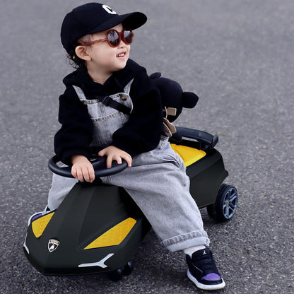 Black swing car with yellow hood; child seated at the steering wheel