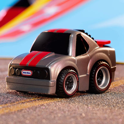 Toy race car in dark gray with red stripe and black wheels