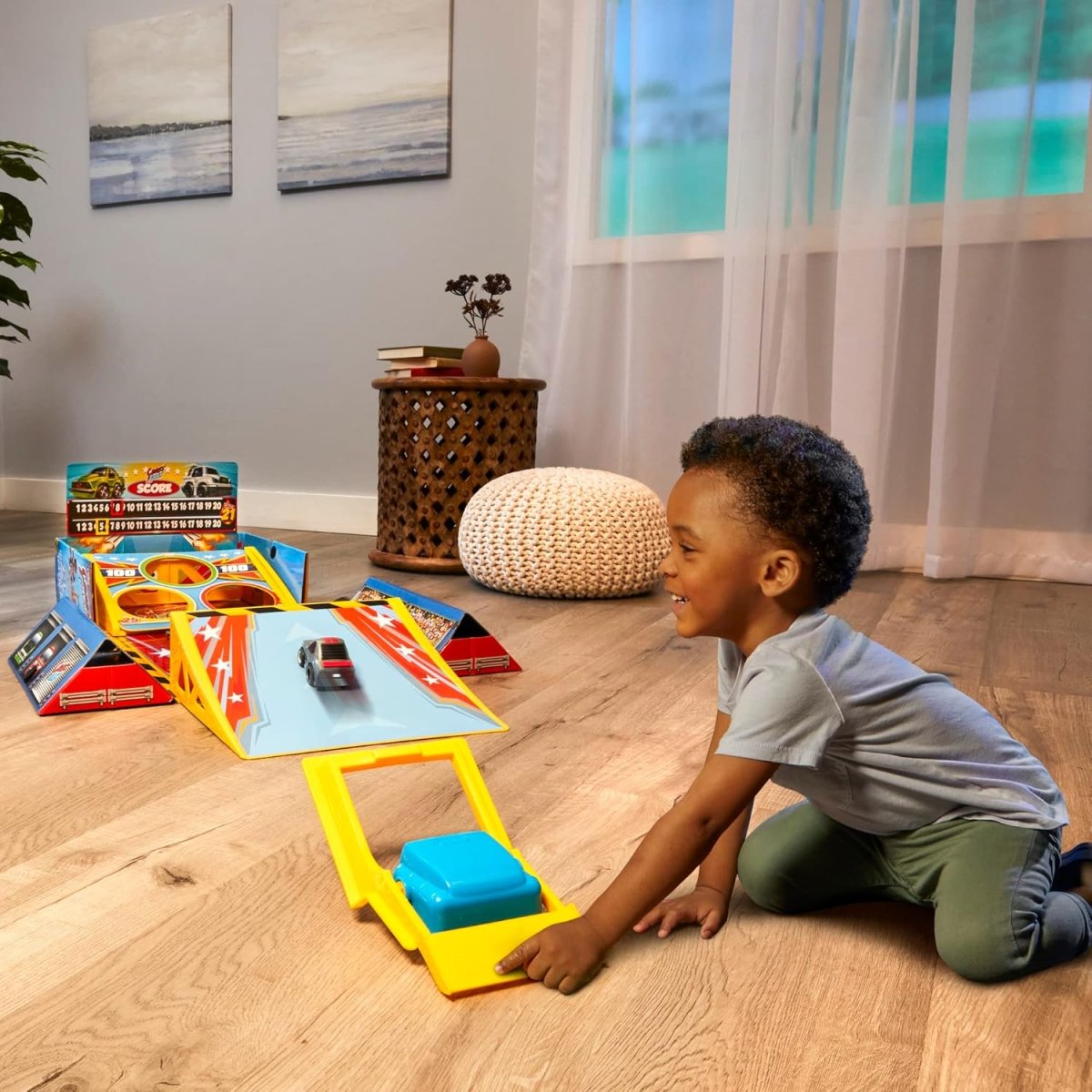 4-in-1 car game set with yellow ramp and small toy car on the track