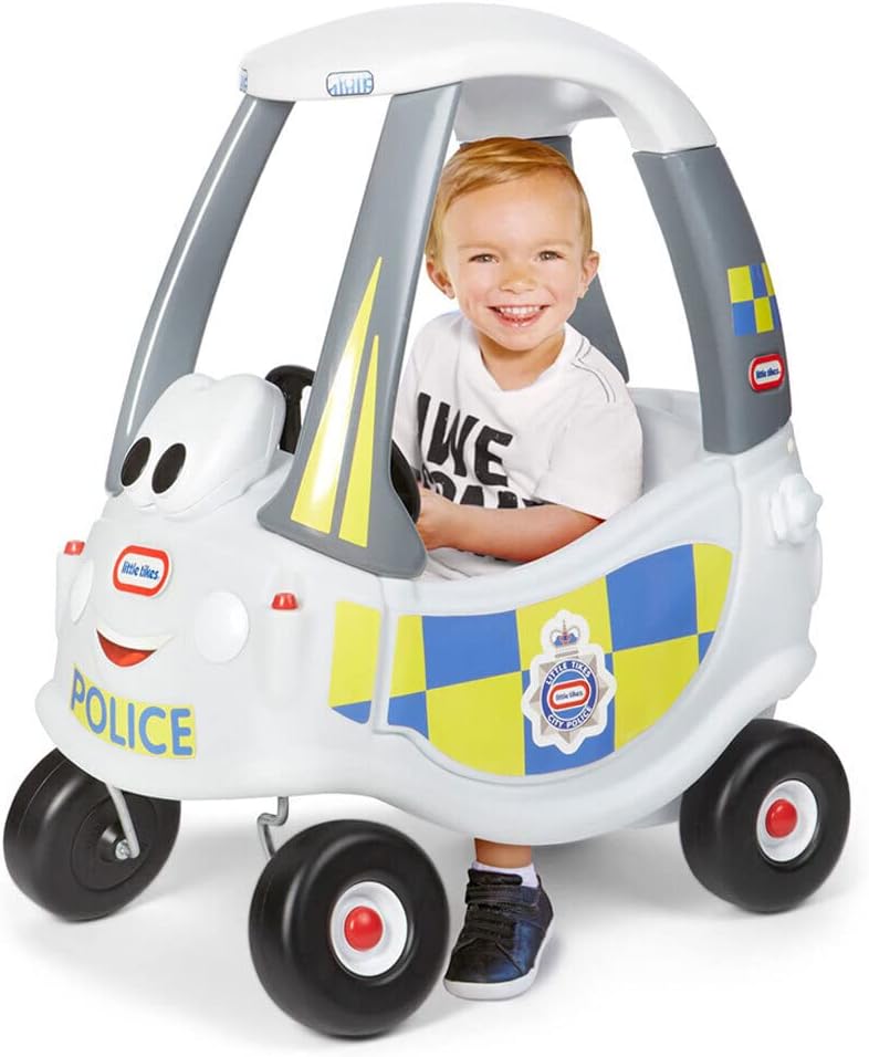 White police ride-on car with checkered side panels and a child seated inside