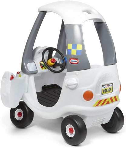 White police ride-on car with steering wheel, dashboard details, and police badge