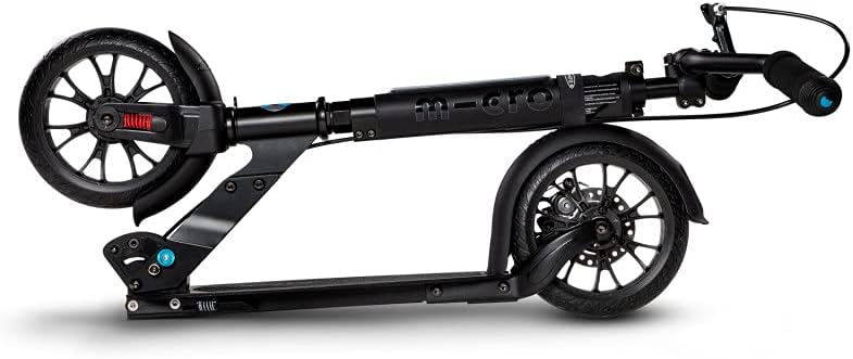 Black kick scooter side view with dual wheels, front wheel fender, and fold joint
