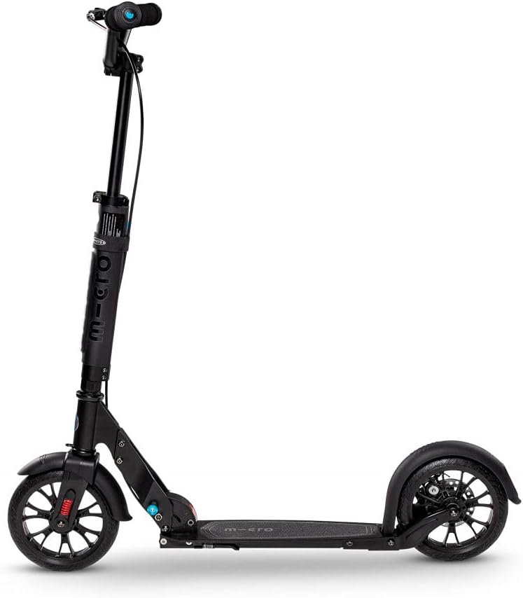 Black kick scooter with headlight on handlebar, wide standing deck, and pneumatic tires