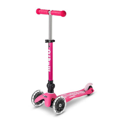 Pink foldable mini LED scooter with handle grips and front wheel, standing upright