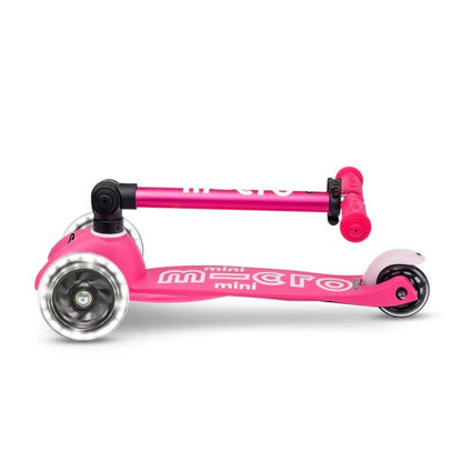 Pink foldable mini LED scooter, side view with large front and rear wheels