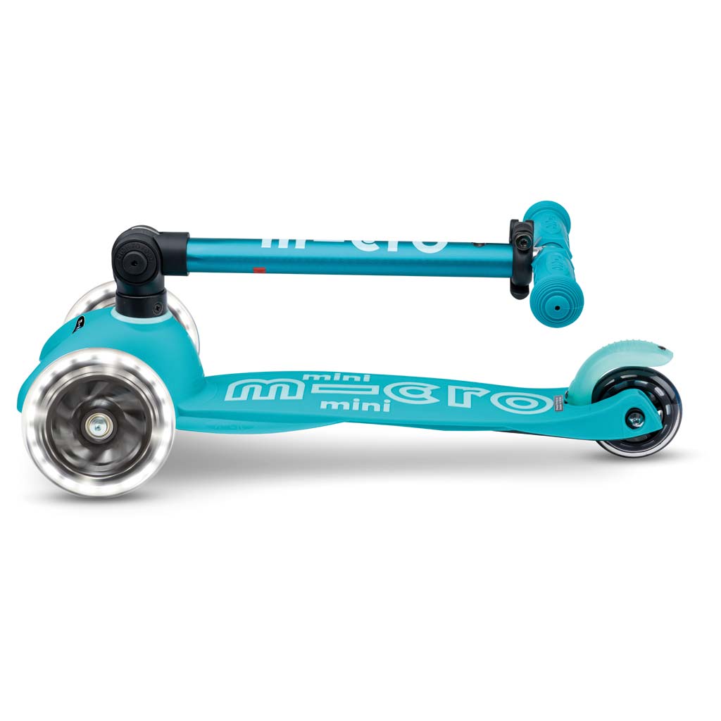 Mini Micro Deluxe Foldable LED scooter in teal, side view with front and rear wheels