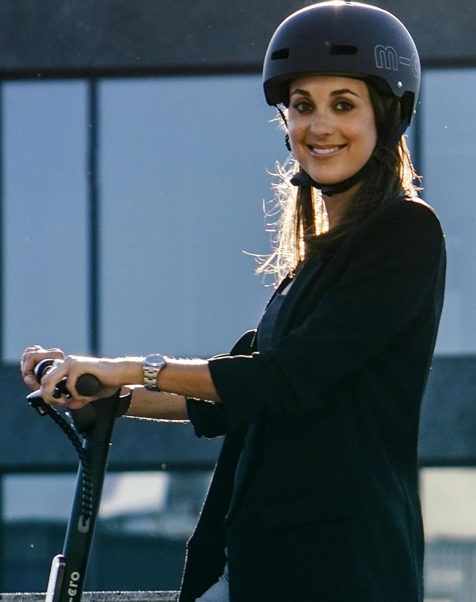Children's ABS helmet worn by a person outdoors, matte black with white m-cro logo