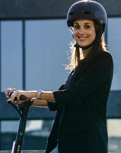 Children's ABS helmet worn by a person outdoors, matte black with white m-cro logo
