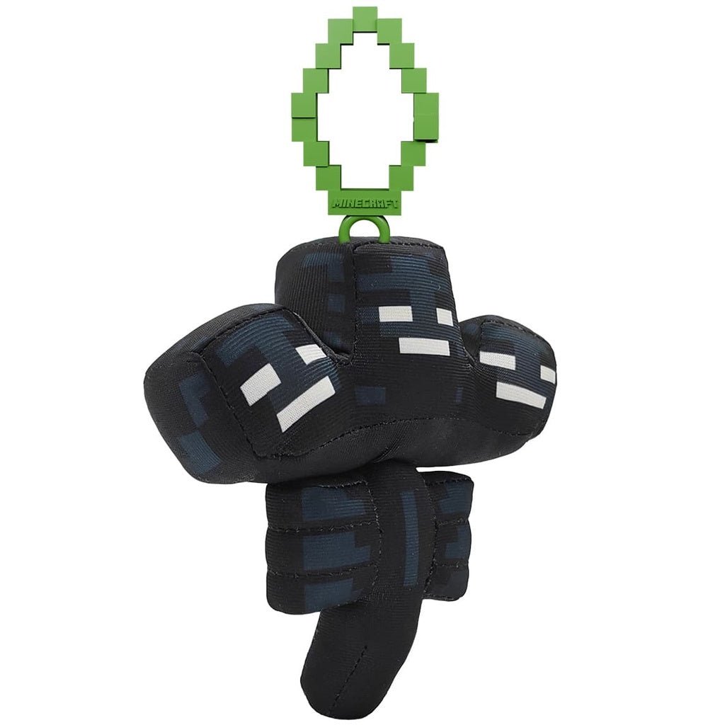 Clip-on Plüsch: schwarzer Pixel-Body mit weißen Augen, hängend am grünen Clip