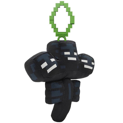Clip-on Plüsch: schwarzer Pixel-Body mit weißen Augen, hängend am grünen Clip