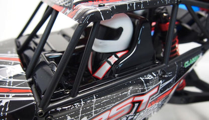 RC buggy cockpit with black roll cage and racing decals