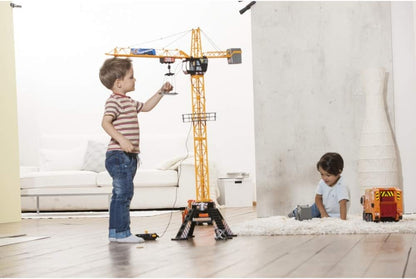 Tall play crane toy with remote control and hanging hook, used indoors