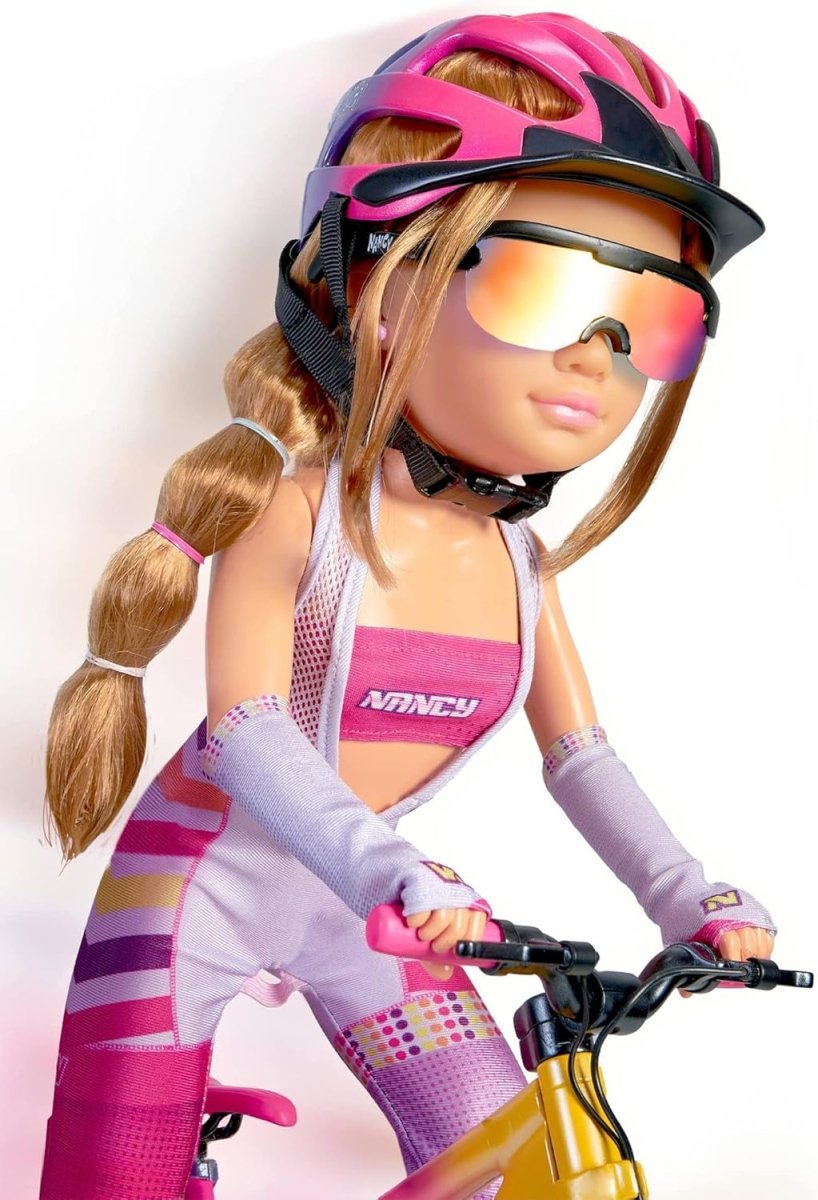 Mountain bike doll close-up wearing pink helmet and rainbow-tinted visor goggles